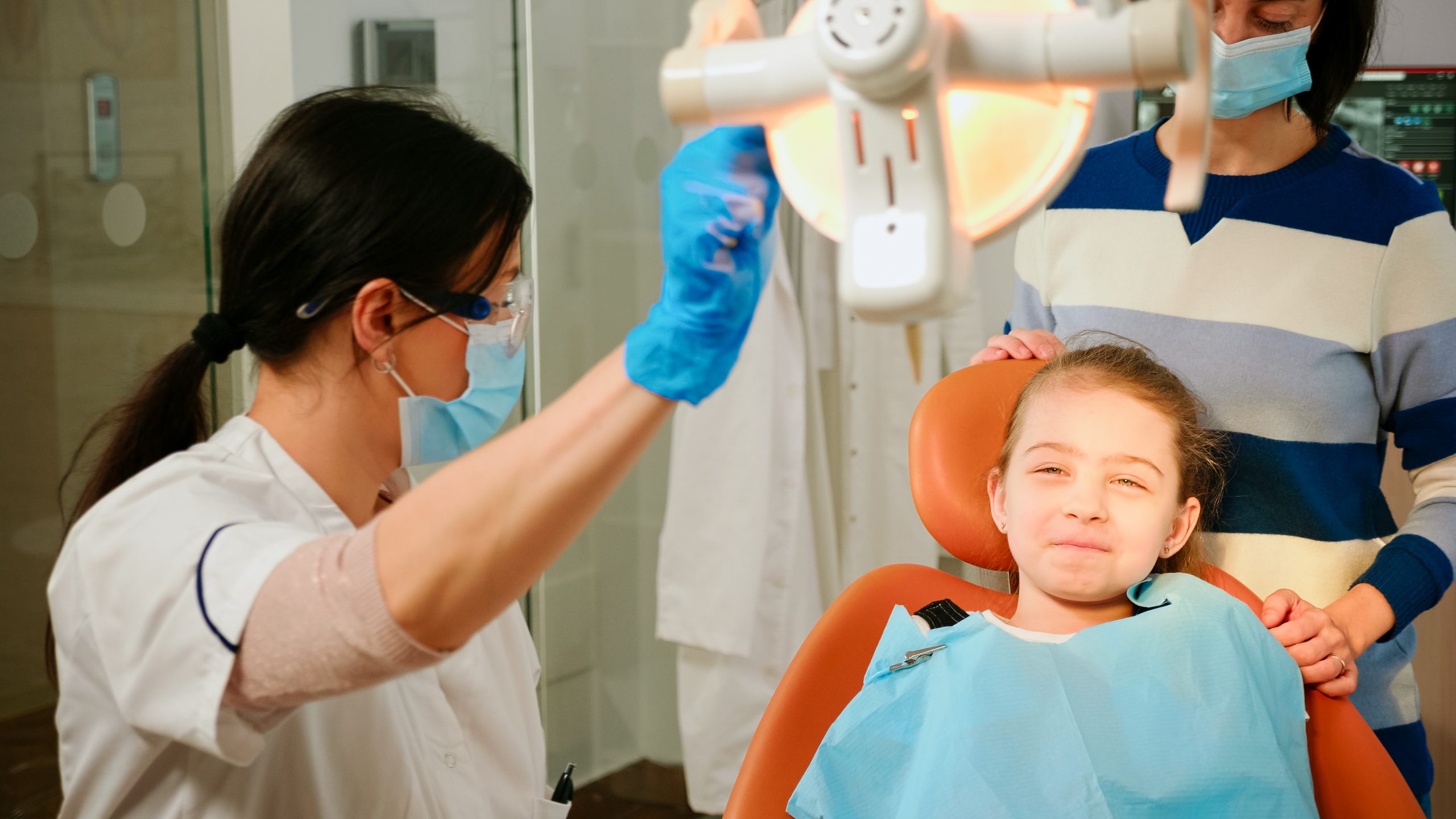 Parent comforting a child during an emergency dental visit